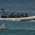 Indonesian police claim Australia sent back dozens of illegal migrants to a remote island