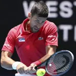 Djokovic battles through wrist pain as Australian Open nears