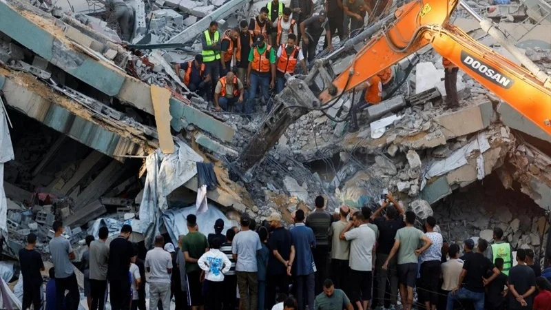 War-damaged Gaza building collapses, killing 12, dozens feared trapped