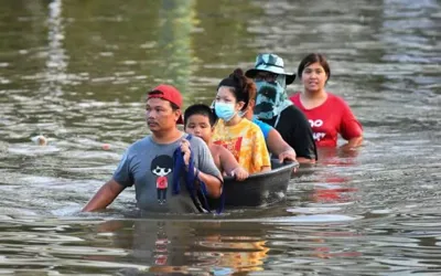 Heavy rain triggers flooding in Bangkok, forces evacuations