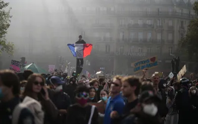 Clashes erupt after hundreds of thousands protest across France
