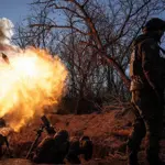 Russian soldiers charged in murder of pro-Moscow U.S. fighter