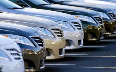 What's causing the drop in car prices in Pakistan