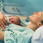 Trauma to Triumph: woman assists in her own caesarean birth