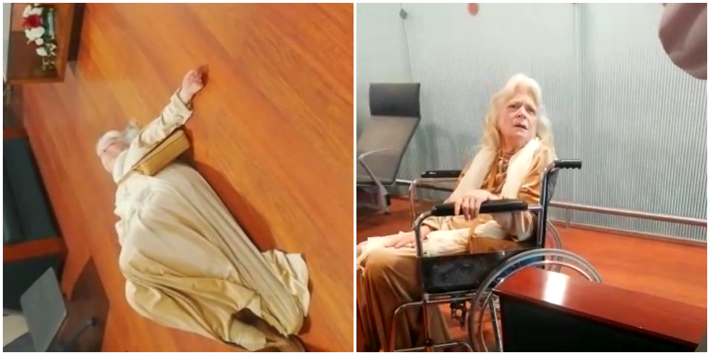 woman lies on airport floor