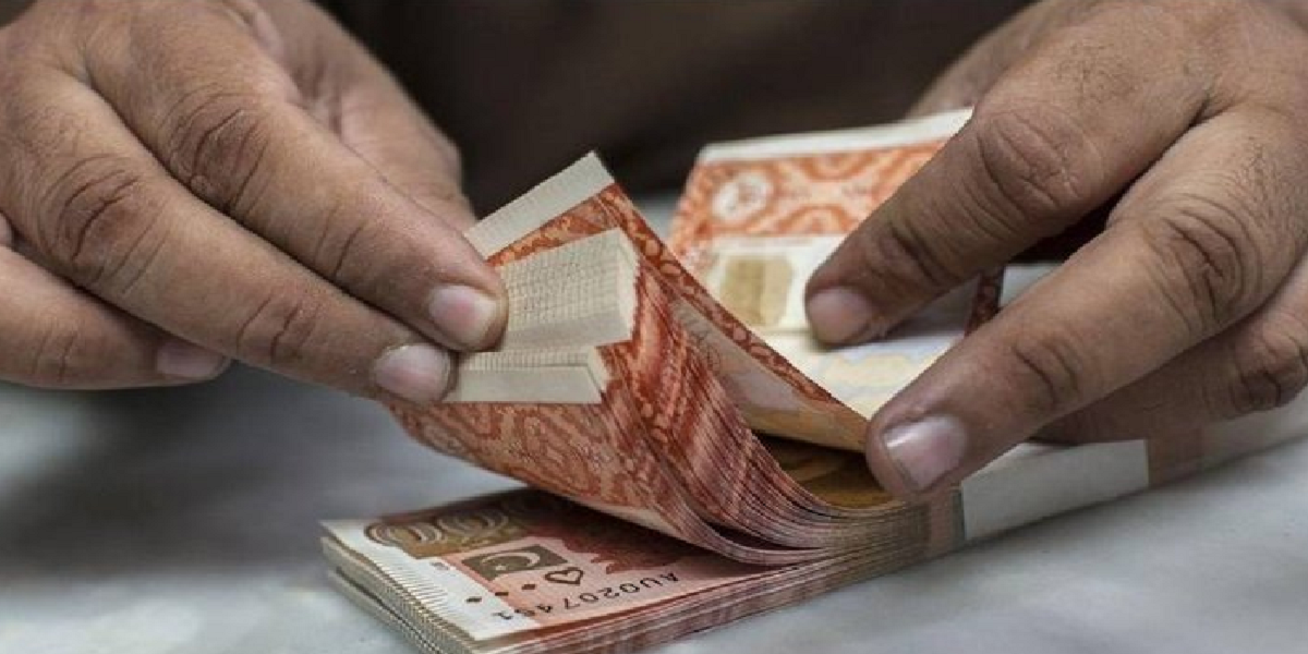 Cash counting Pakistani currency