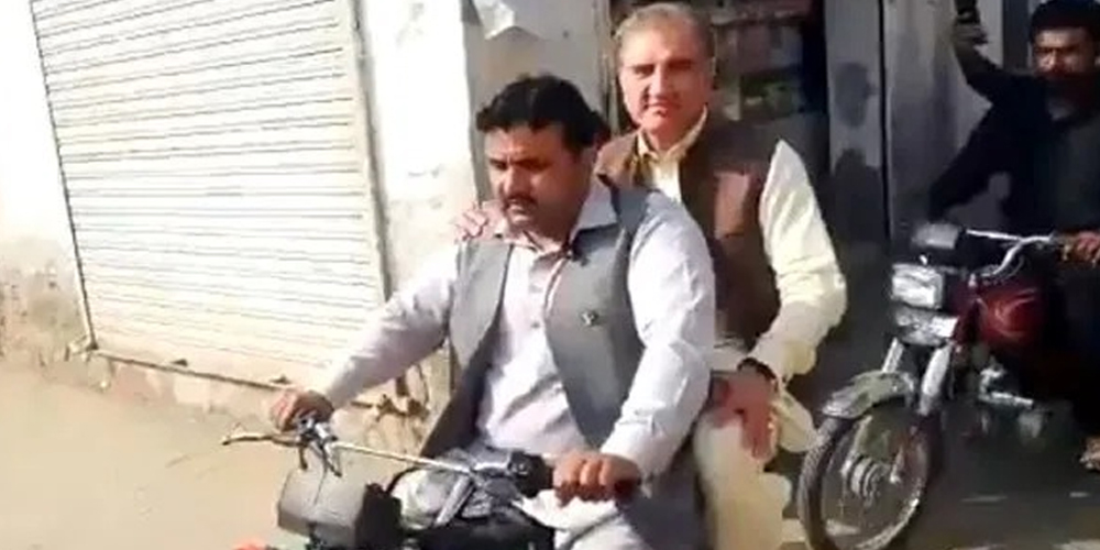 Why Foreign Minister Qureshi is roaming on a Motorcycle?