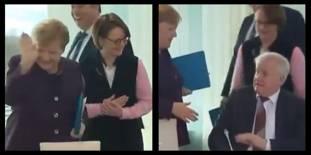 German Interior Minister refuses to shake hand with Angela Merkel