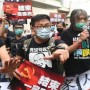 Hong Kong celebrates hand over, ‘anti-protest’ law comes into effect