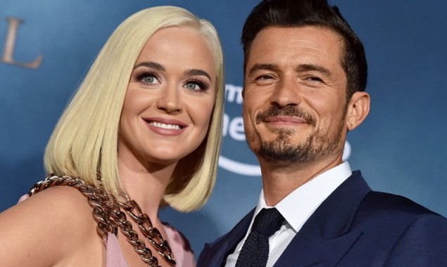 Katy Perry was spotted showing off her baby bump as she danced outside a car