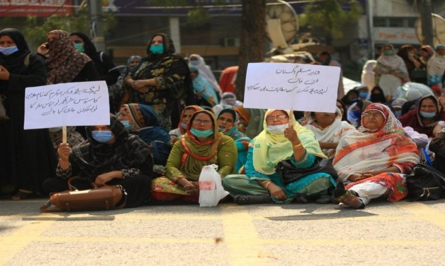 Female health-care workers continue their sit-in on sixth day