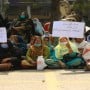 Female health-care workers continue their sit-in on sixth day