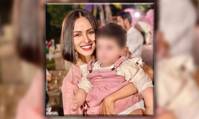 Whose baby is Nimra Khan holding in the picture?