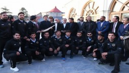 Afghan Cricket Team signed bat to PM
