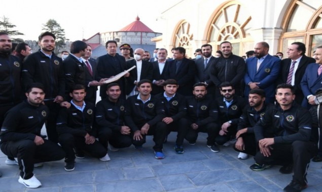 Afghan cricket team bestows a signed bat to PM Imran during his maiden visit to Kabul