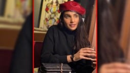 Amna Ilyas Poses With Red Ankle Boots To Stay Winter Chic