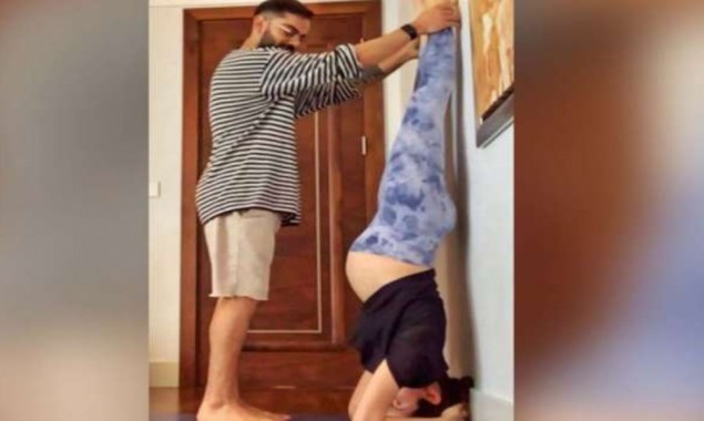 Virat Kohli helps Anushka Sharma to do yoga, picture goes viral