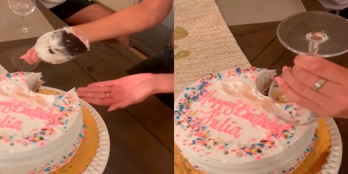 Woman cuts cake with wine glass