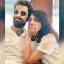 Model Amna Ilyas interrupted by a sweet kiss while recording video