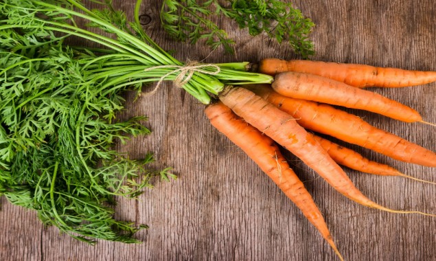 What other benefits may carrots have apart from increasing vision?