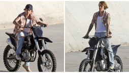 Justin Bieber models riding a dirt bike on the banks of Los Angeles River