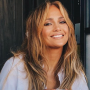 Jennifer Lopez shows a cheerful smile with coffee talk