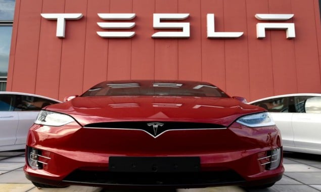 Tesla reports record profits, bullish on 2022 output