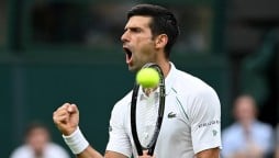 Djokovic reaches Wimbledon third round