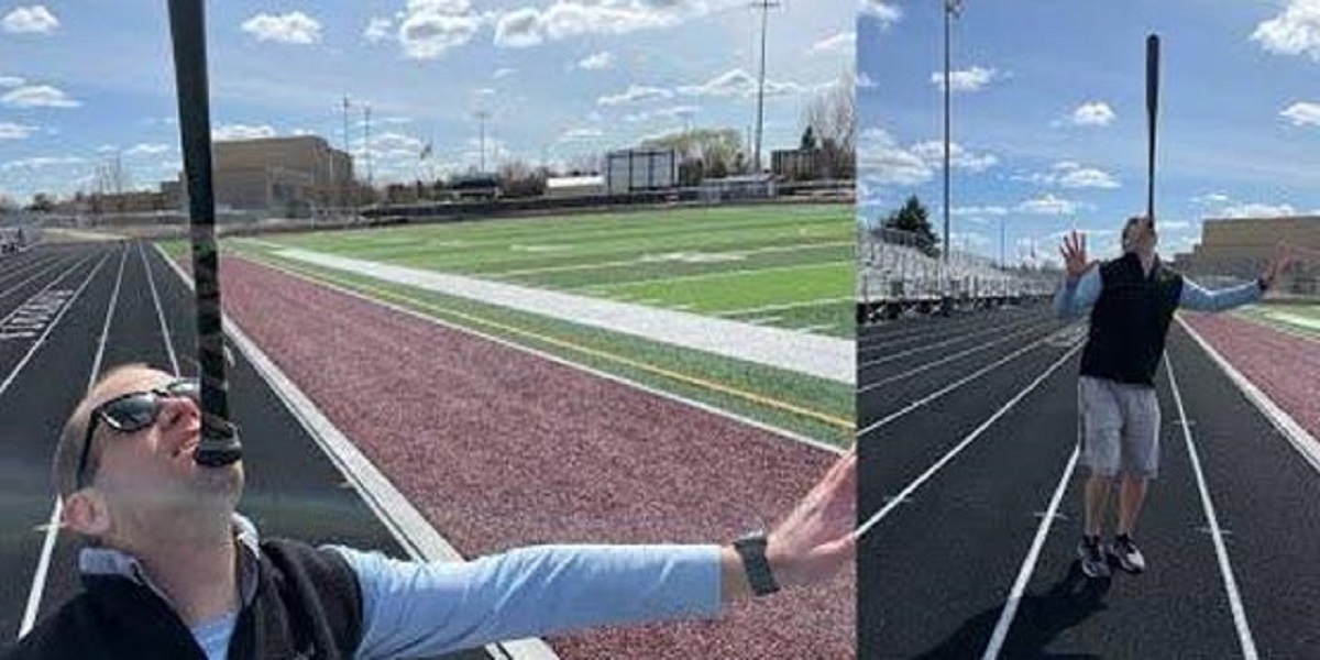 Man walks 2.2 miles while holding a baseball bat on chin