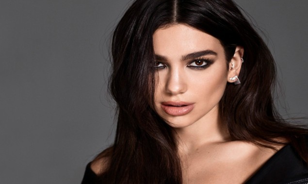 Dua Lipa flaunts her toned body in this glittering attire