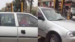 Traffic police lift a car with woman inside