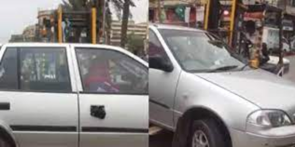 Traffic police lift a car with woman inside