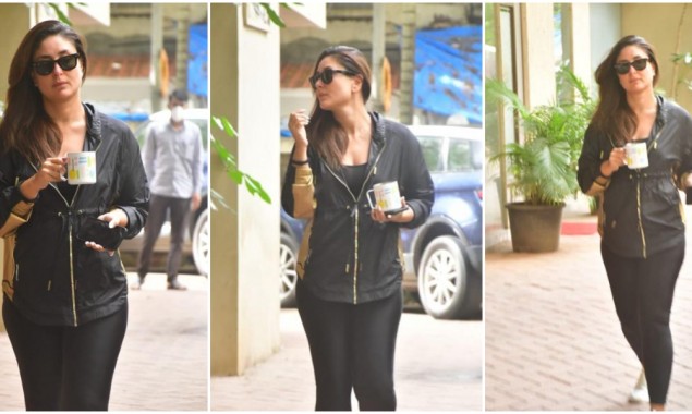 Kareena Kapoor carries her morning cup of coffee as she heads to work