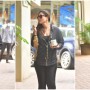 Kareena Kapoor carries her morning cup of coffee as she heads to work