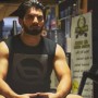 Muneeb butt flaunts his ripped muscles in a gym Photo