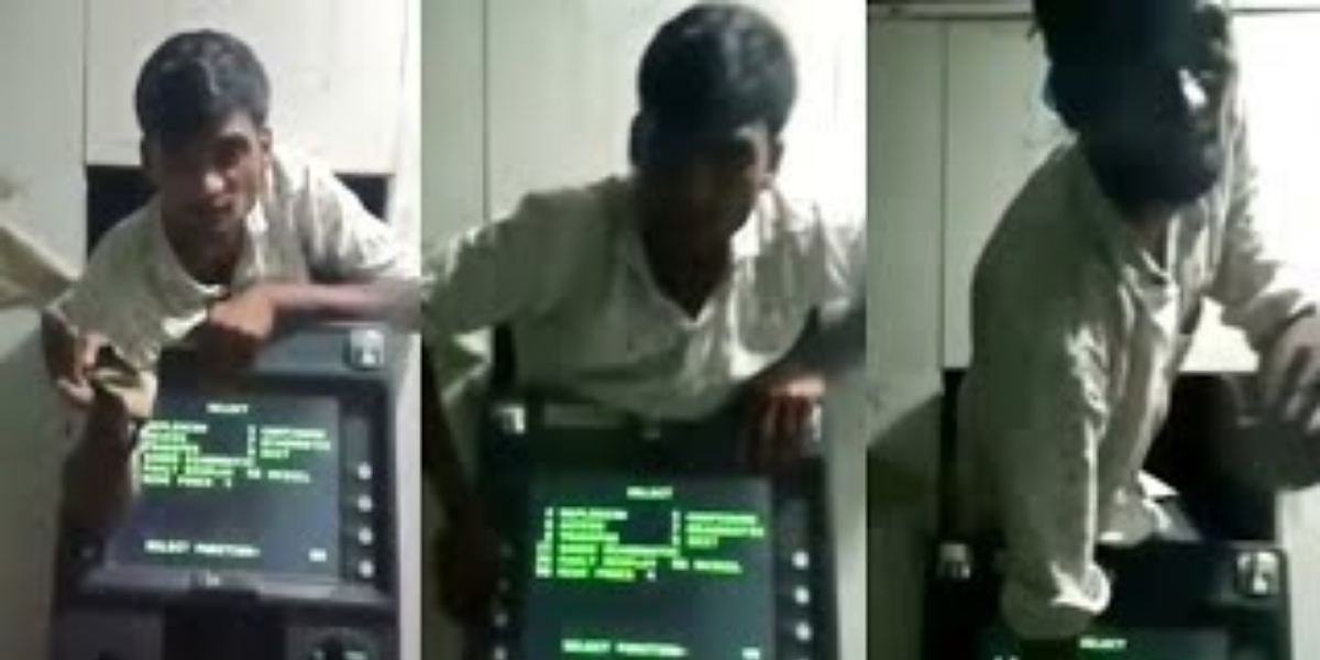 man stuck between ATM