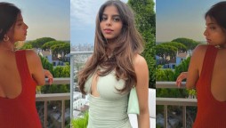 Suhana Khan poses in a sleeveless red dress with a backless cut