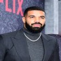 Drake proves his status as a millionaire by showing off his cash 