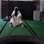 Video: Woman wearing abaya and niqab exercising on loaded machines