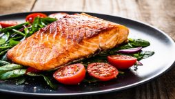 Migraines can be relieved by eating oily fish salmon