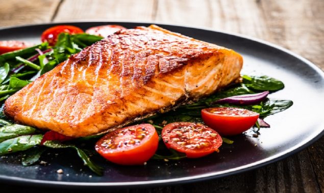 Migraines can be relieved by eating oily fish salmon