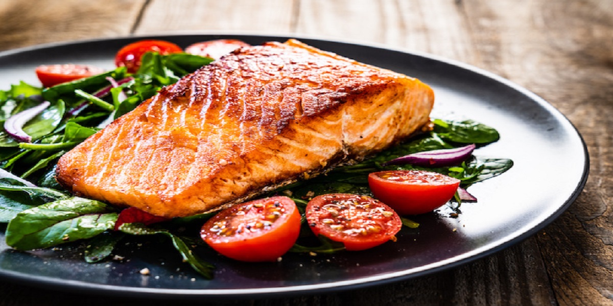 Migraines can be relieved by eating oily fish salmon