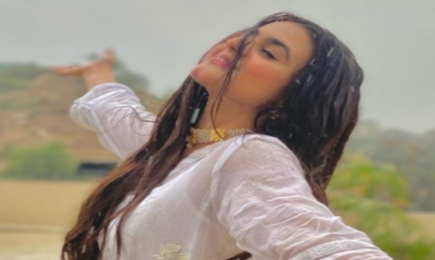 Actress Hira Mani enjoys rain in Karachi