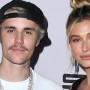 Justin Bieber looks enthusiastic while posing with wife in black tuxedo