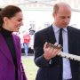 During a visit to the zoo Prince William plays with a snake