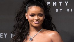 Rihanna slays in a pink & purple crotchless wear to promote her brand