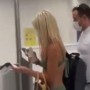 Woman passenger walks through airport in just bikini and face mask—Video goes viral