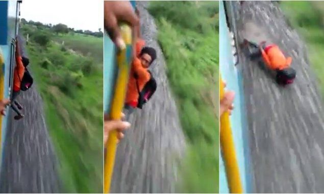 Young boy attempts dangerous stunts on moving train