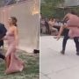 A hyped entry, bride and groom fall off the stage while dancing