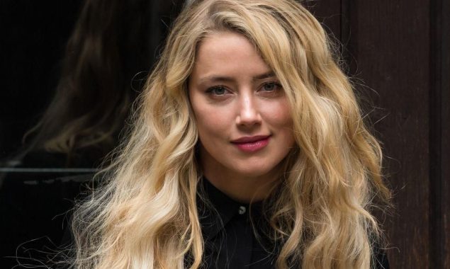 Amber Heard shows off her multi-tasking skills as a new mother